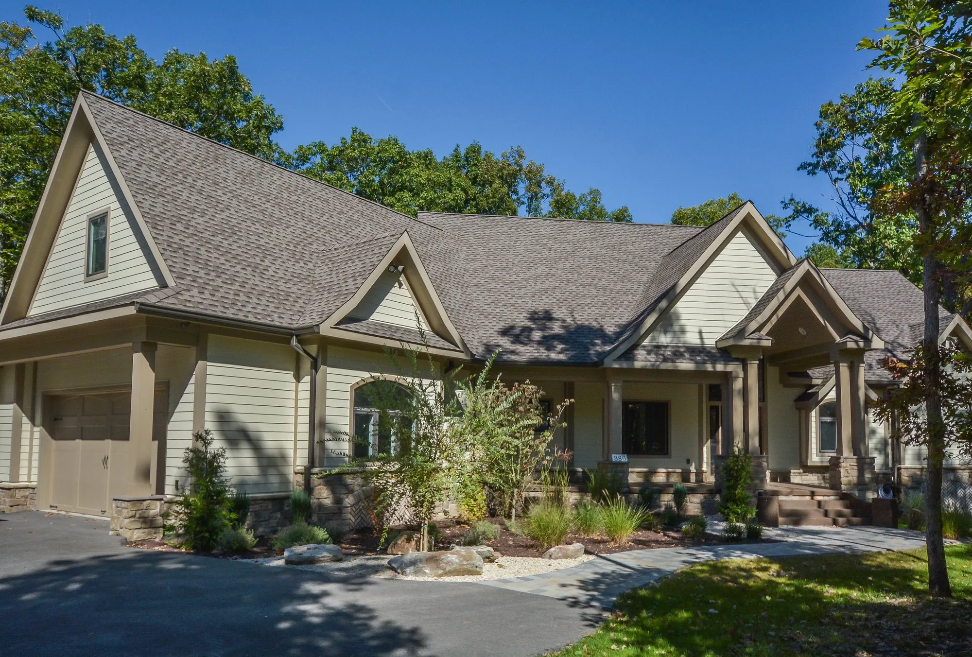 Woodland Chalet front exterior and garage among the trees