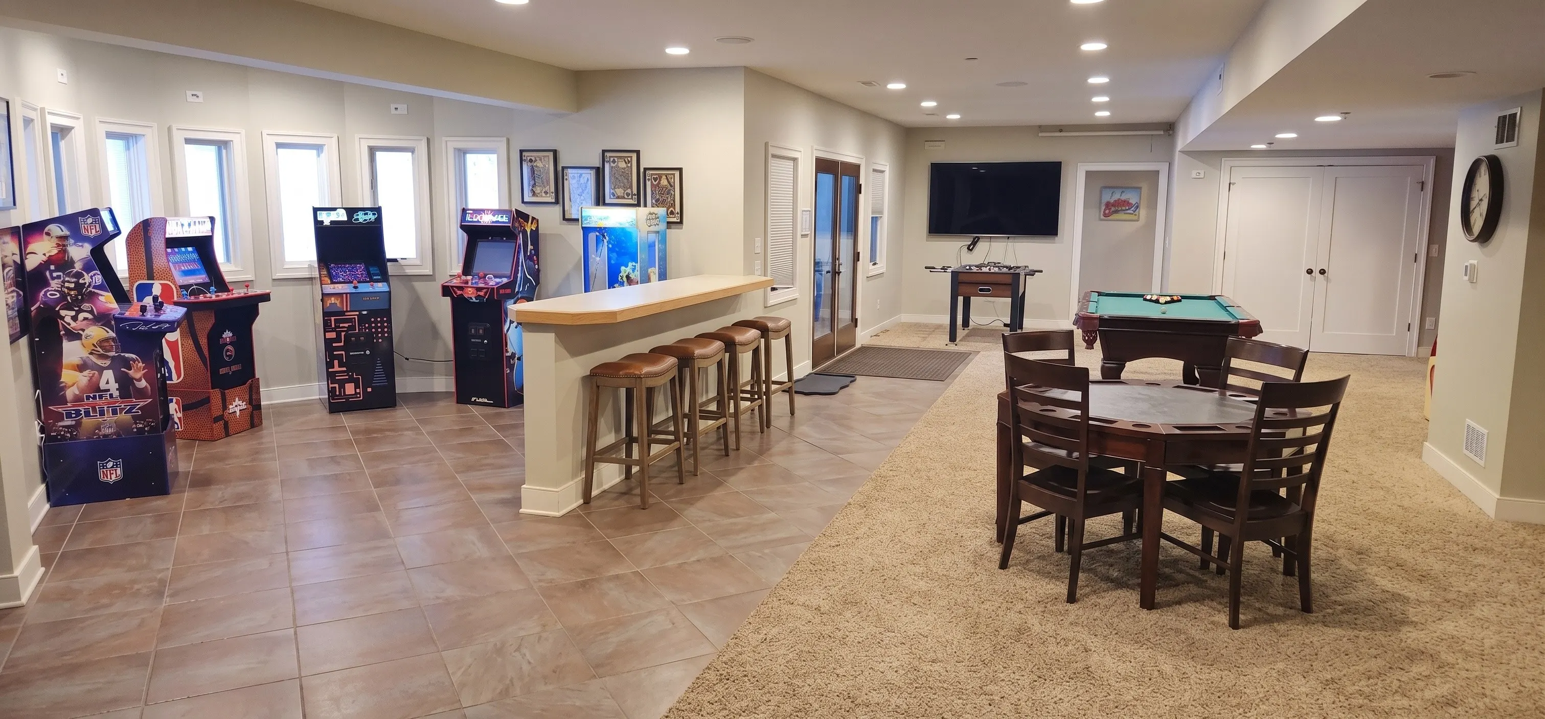Game room with a pool table and foosball table
