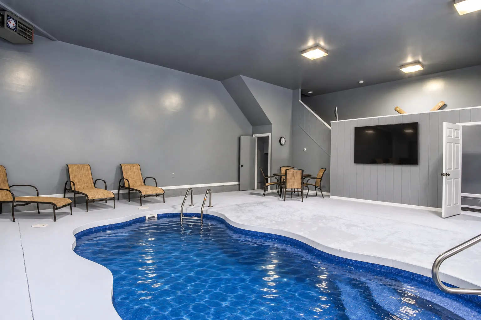 Private heated indoor pool in the dedicated pool house at Woodland Chalet