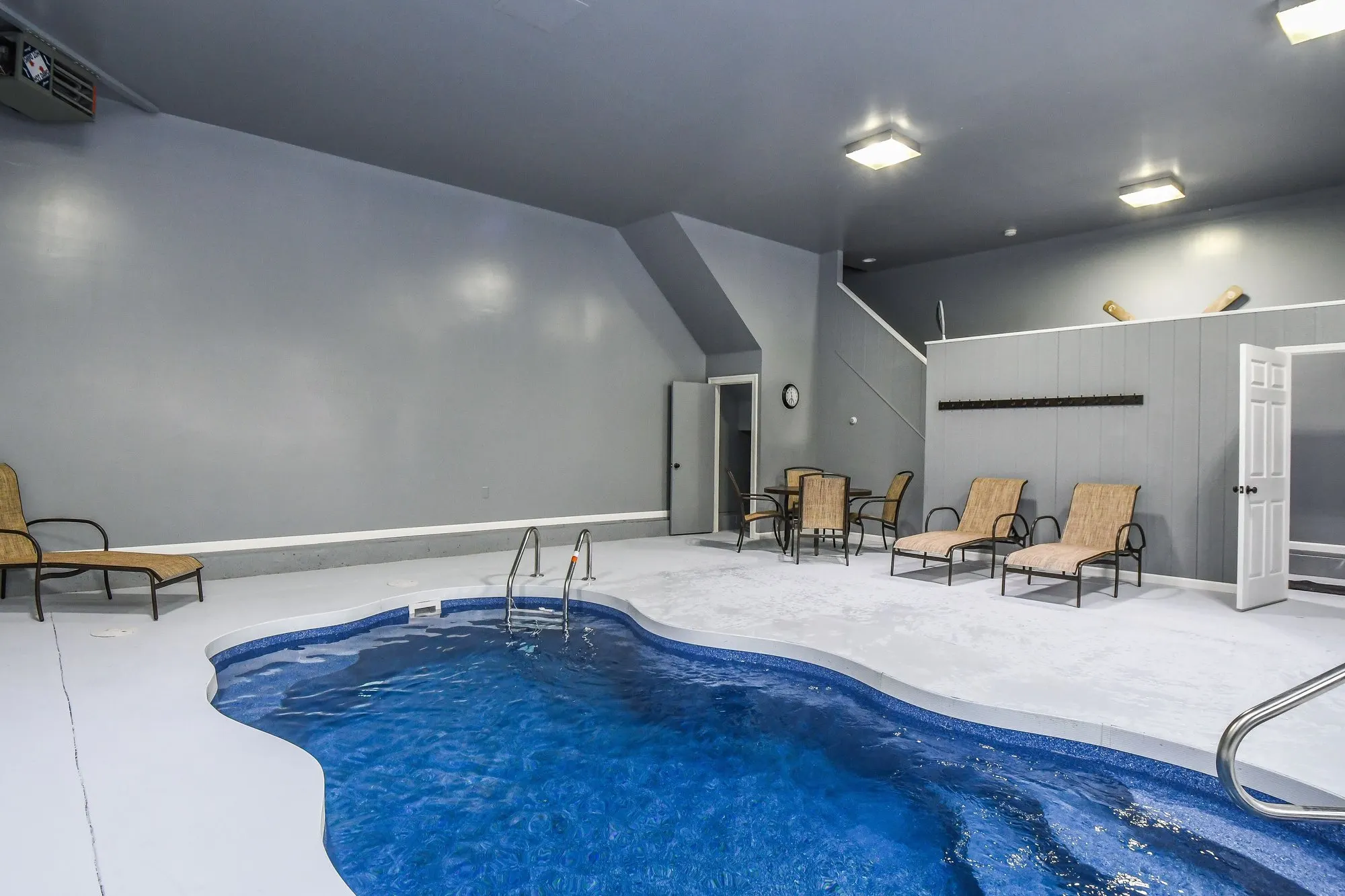 Private heated indoor pool in the dedicated pool house at Woodland Chalet