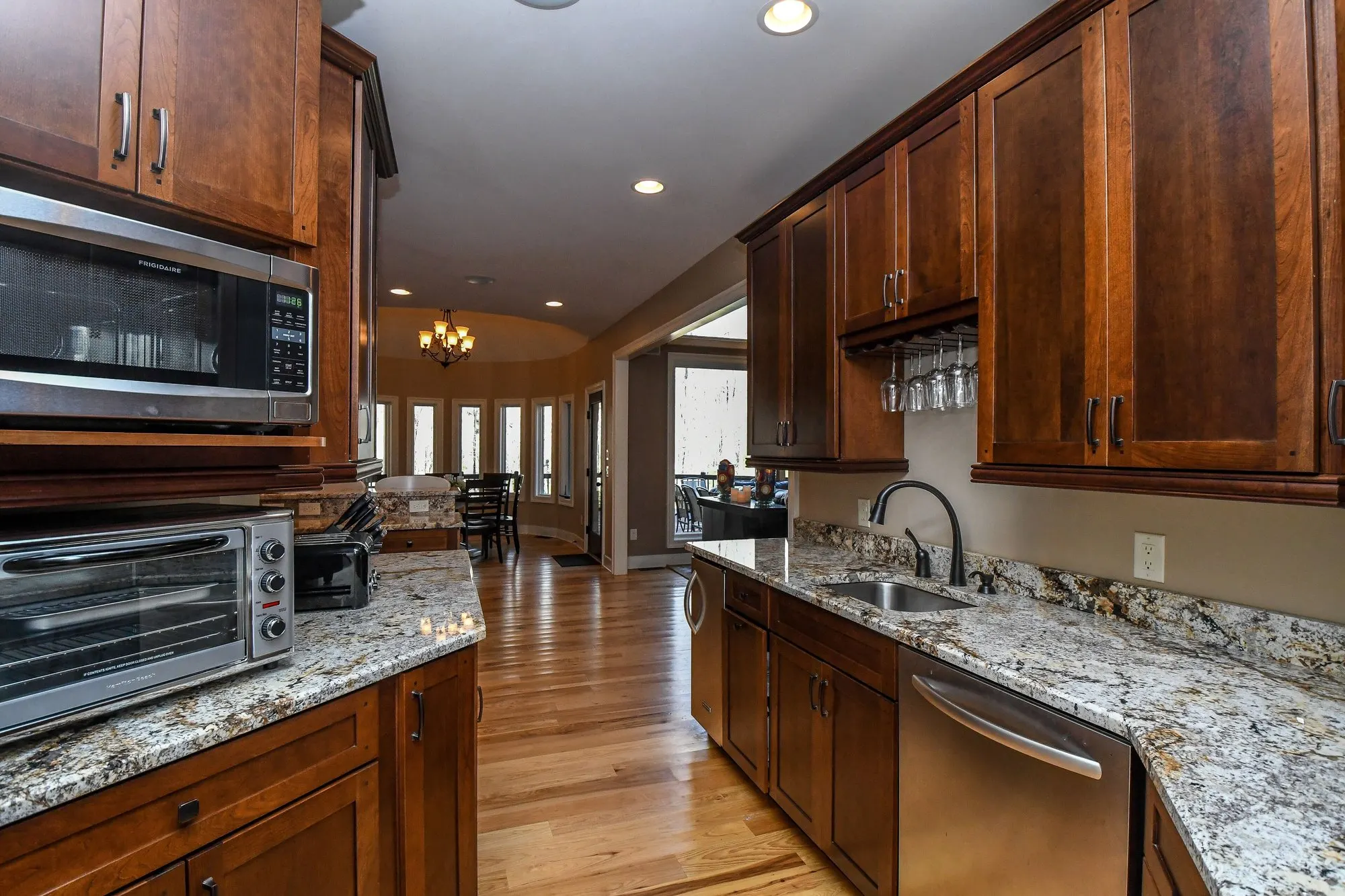Main kitchen island sink with stainless appliances