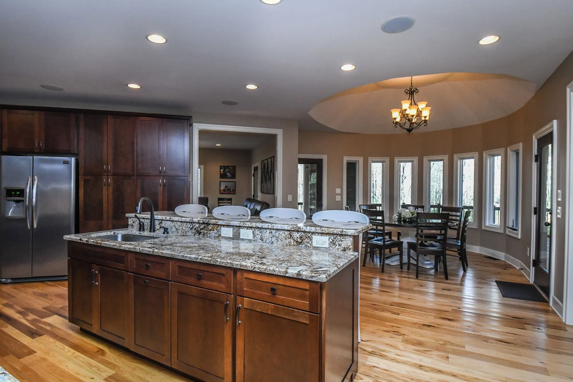 Main kitchen island with the breakfast nook behind