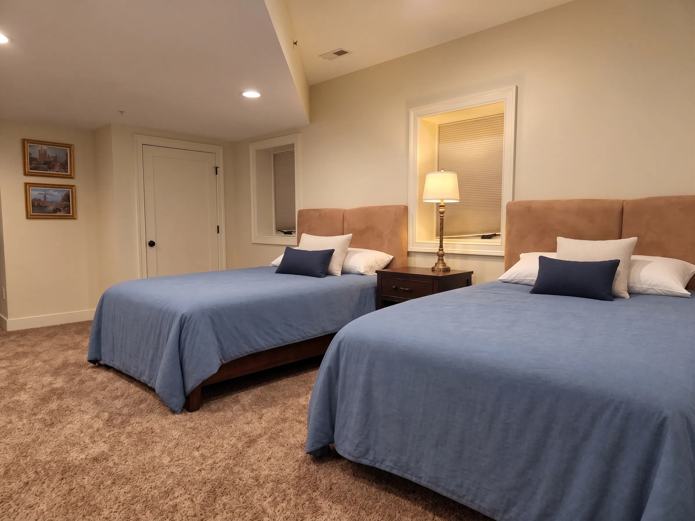 The lower level second suite's two guest beds
