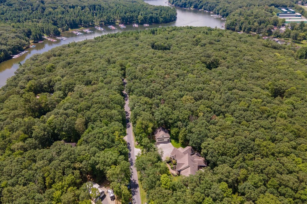 Aerial perspective of Woodland Chalet and surrounding Deep Creek Lake mountain landscape