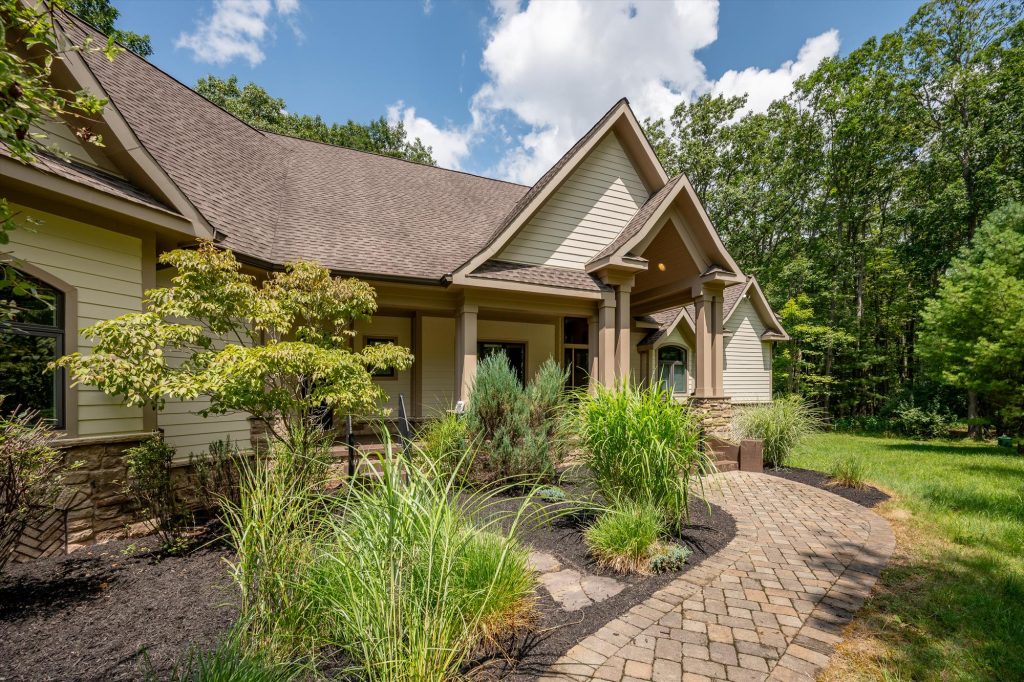 Welcoming front entrance of Woodland Chalet with covered porch