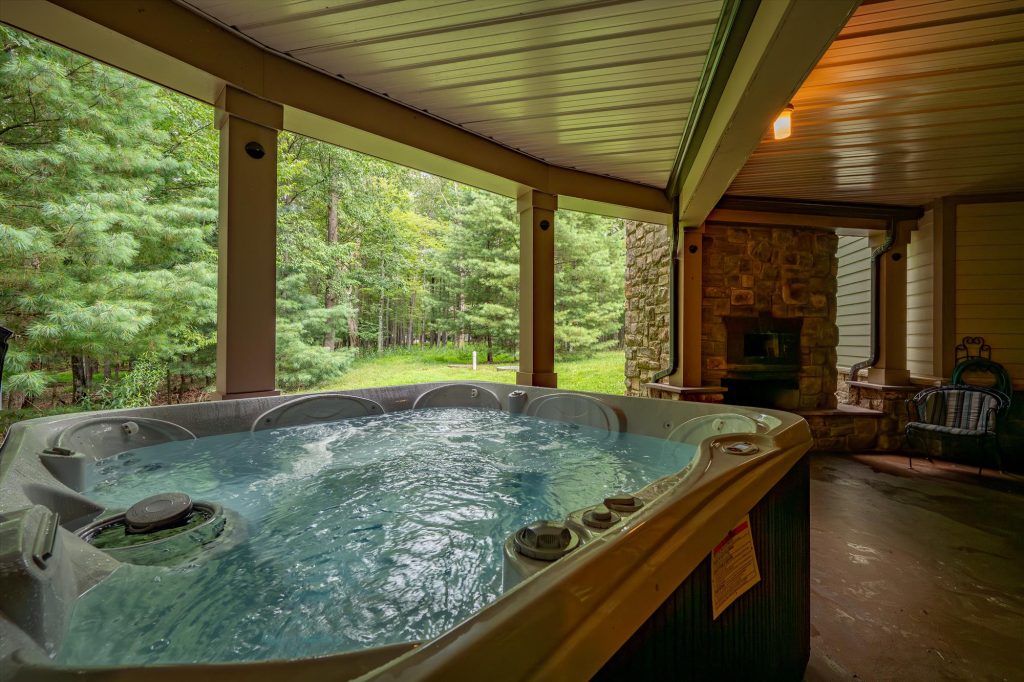 Hot tub with woodland views perfect for relaxing after a day at the lake