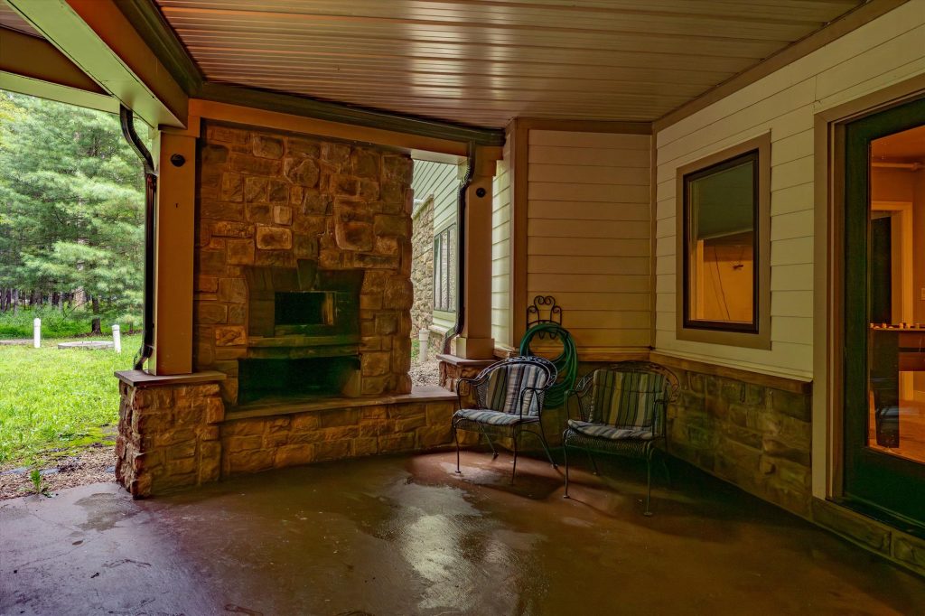 Lower level patio with outdoor seating and access to the hot tubs