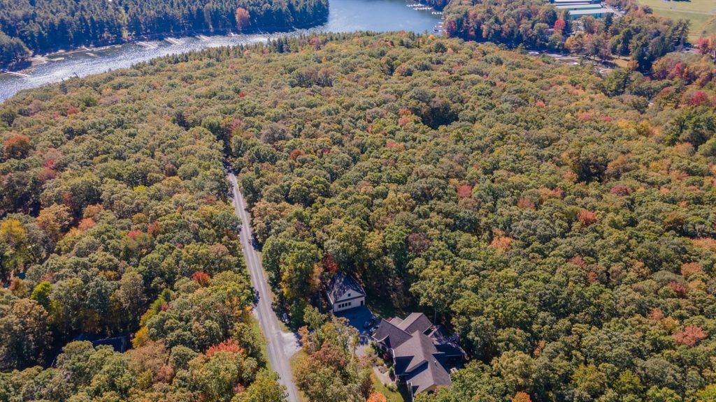 Aerial view of Woodland Chalet showing full property layout and wooded setting at Deep Creek Lake