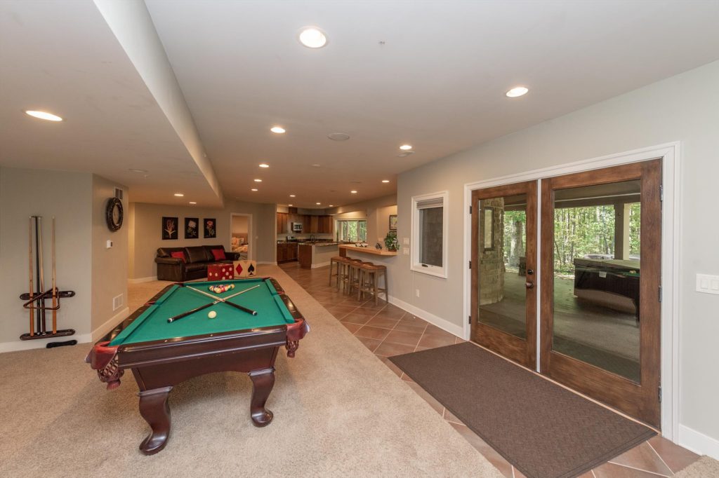 Game room alternate view showing the full 17-by-45-foot entertainment space