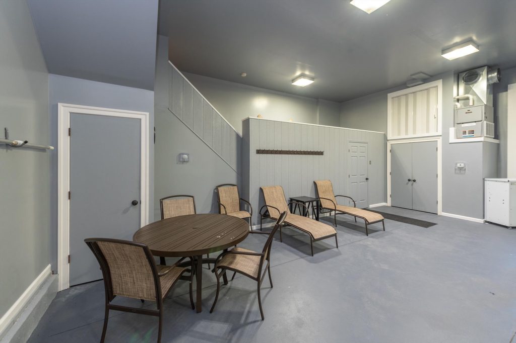 Alternate view of the heated indoor pool showing seating area and pool deck