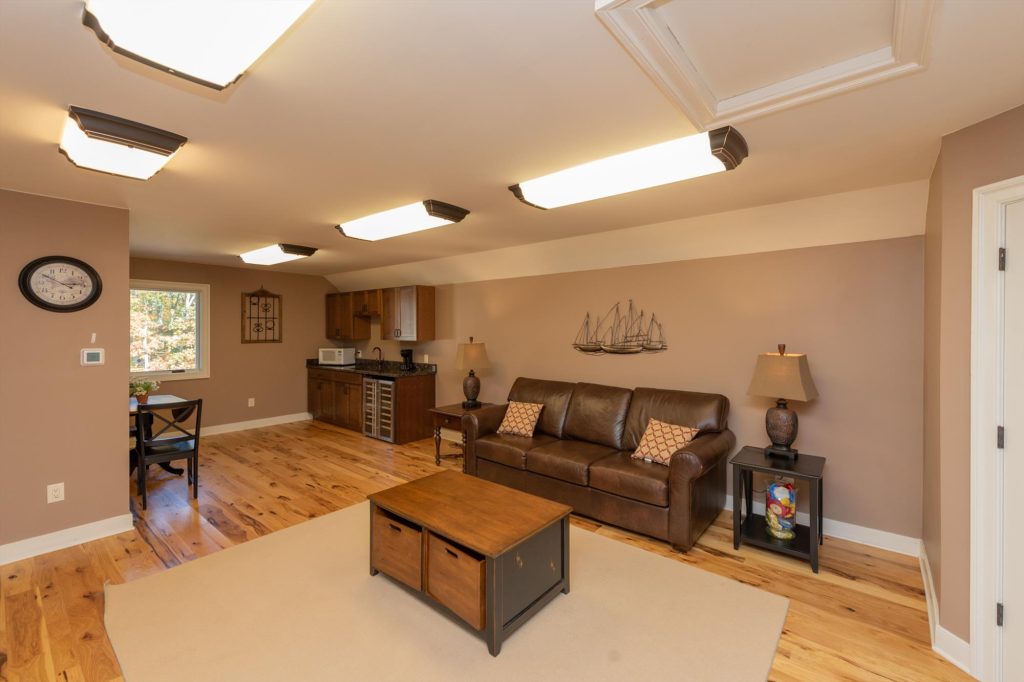 Pool house upper lounge with wet bar and relaxed seating for guests