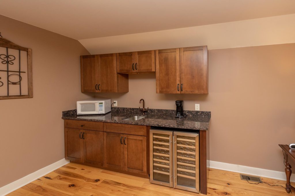 Wet bar in the pool house upper lounge for convenient drink preparation