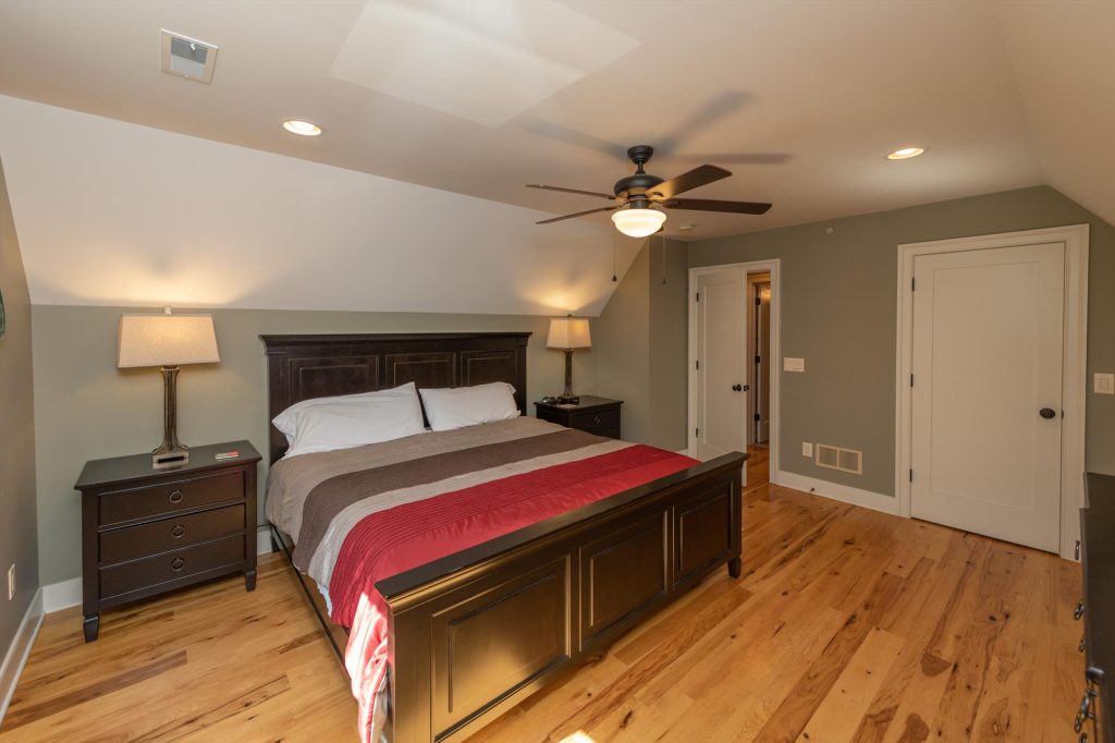 Upper level bedroom with king bed and mountain retreat atmosphere